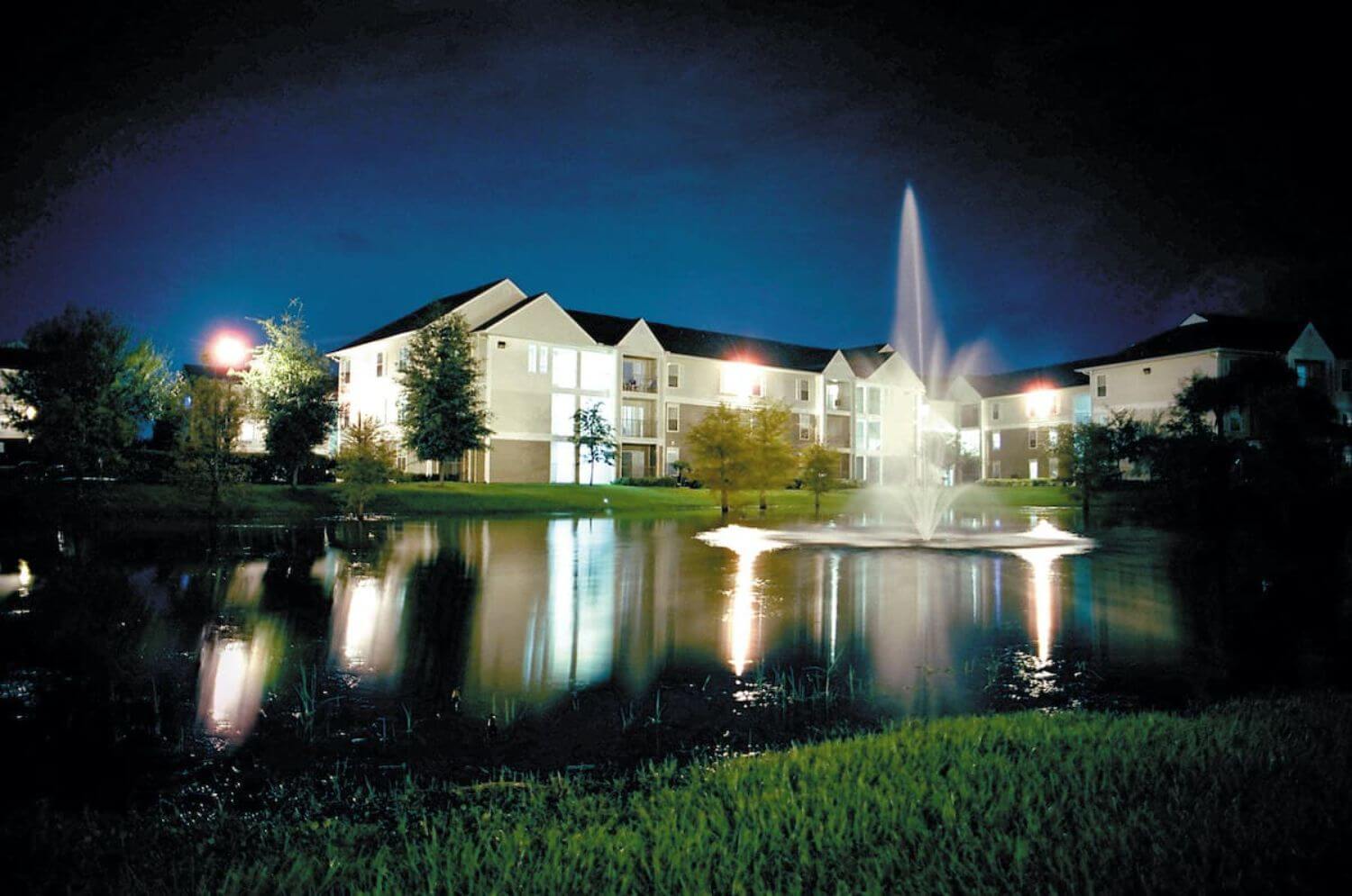 exterior view of northgate lakes apartments at night